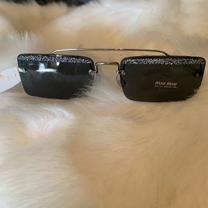 These are gorgeous Miu Miu black frame tint with little diamond crystals